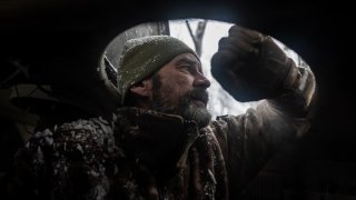 A Ukrainian soldier is seen inside an artillery vehicle in his fighting position as Russia-Ukraine war continues in the direction of Kharkiv, Ukraine on November 20, 2023.