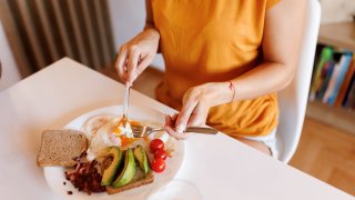 Close-up shot of unrecognizable young woman having healthy breakfast at home