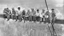 While New York's thousands rush to crowded restaurants and congested lunch counters for their noon day lunch, these intrepid steel workers atop the 70 story RCA building in Rockefeller Center get all the air and freedom they want by lunching on a steel beam with a sheer drop of over 800 feet to the street level. The RCA building is the largest office building in terms of office space in the world. (original caption). Image taken 9/20/32; filed 9/29/32.