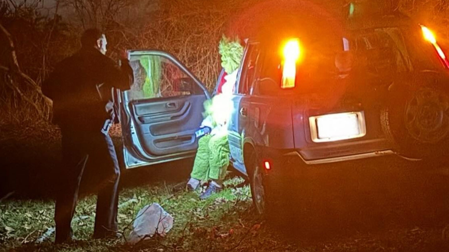 Exeter, New Hampshire, police at the scene of a car crash involving a man dressed as the Grinch on Christmas 2023.