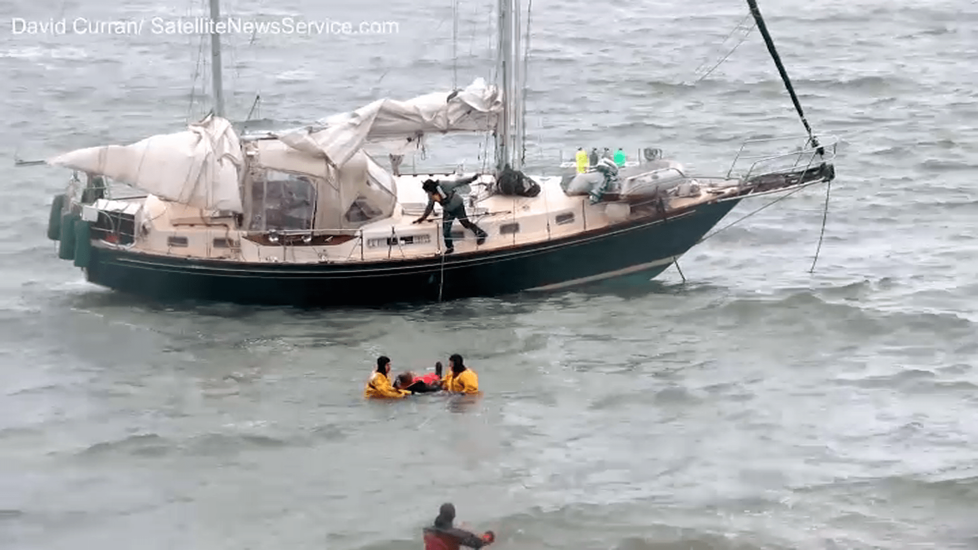 A water rescue involving a sailboat close to shore in Plymouth, Massachusetts, on Wednesday, Dec. 6, 2023.