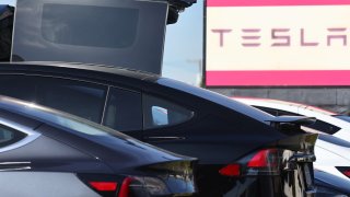 BURBANK, CALIFORNIA – JANUARY 16: Tesla electric cars are parked at a Tesla dealership on January 16, 2024 in Burbank, California. Carbon emissions fell by about 1.9 percent in 2023, a positive signal, but further cuts must be implemented if the U.S. hopes to achieve its climate goal of 50 percent emissions cuts by 2030. (Photo by Mario Tama/Getty Images)