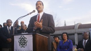 FILE – Dexter King, son of Martin Luther King Jr., speaks to the press outlining his family’s plan for an interactive museum to be built at the MLK Center in Atlanta, Dec. 28, 1994. Dexter Scott King, the younger son of Martin Luther King Jr. and Coretta Scott King, has died after battling prostate cancer. The King Center in Atlanta says the 62-year-old son of the civil rights leader died Monday, Jan. 22, 2024 at his California home after battling prostate cancer. (AP Photo/Leita Cowart, file)