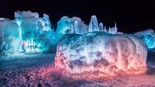 Ice Castles illuminated at night. The New Hampshire Ice Castles are set to open Jan. 20.