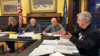 Littleton town manager Jim Gleason, right, talks to the town's selectmen during a meeting on Jan. 22, 2024, in Littleton, N.H. Gleason, whose late son was gay, resigned effective Friday, Feb. 2, 2024, to take a stand against the anti-LGBTQ sentiments being expressed by some people in Littleton.