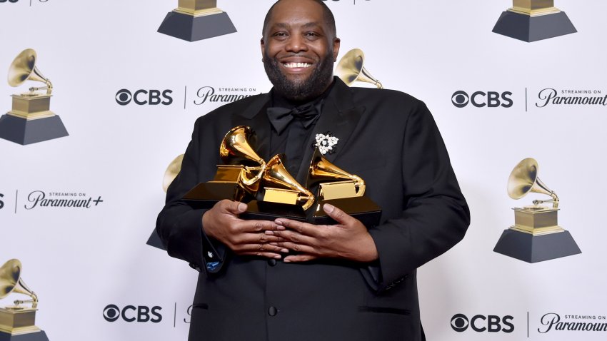 Killer Mike poses in the press room with the awards for best rap performance and best rap song for "Scientists & Engineers," and best rap album for "Michael"