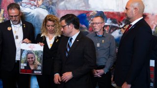 House Speaker Mike Johnson of La., third from left, and Speaker of the Israeli Knesset Amir Ohana, right, stand during a meeting with families of hostages.