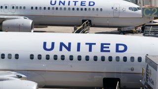 File photo: Two United Airlines Boeing 737s are parked at the gate at the Fort Lauderdale-Hollywood International Airport in Fort Lauderdale, Florida on July 7, 2022.