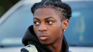 FILE - Darryl George, a 17-year-old junior, before walking across the street to go into Barbers Hill High School after serving a 5-day in-school suspension for not cutting his hair, Sept. 18, 2023, in Mont Belvieu, Texas. A trial is set to be held Thursday, Feb. 21, 2024, to determine if George can continue being punished by his district for refusing to change his hairstyle, which he and his family say is protected by a new state law that prohibits race-based hair discrimination.