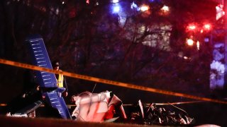 Emergency officials work the scene of a fatal small plane crash in Tennessee