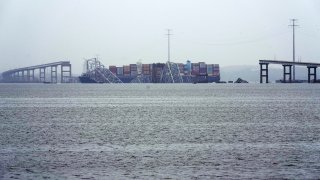 A container ship rests against the wreckage of the Francis Scott Key Bridge on Thursday, March 28, 2024, in Baltimore, Md.