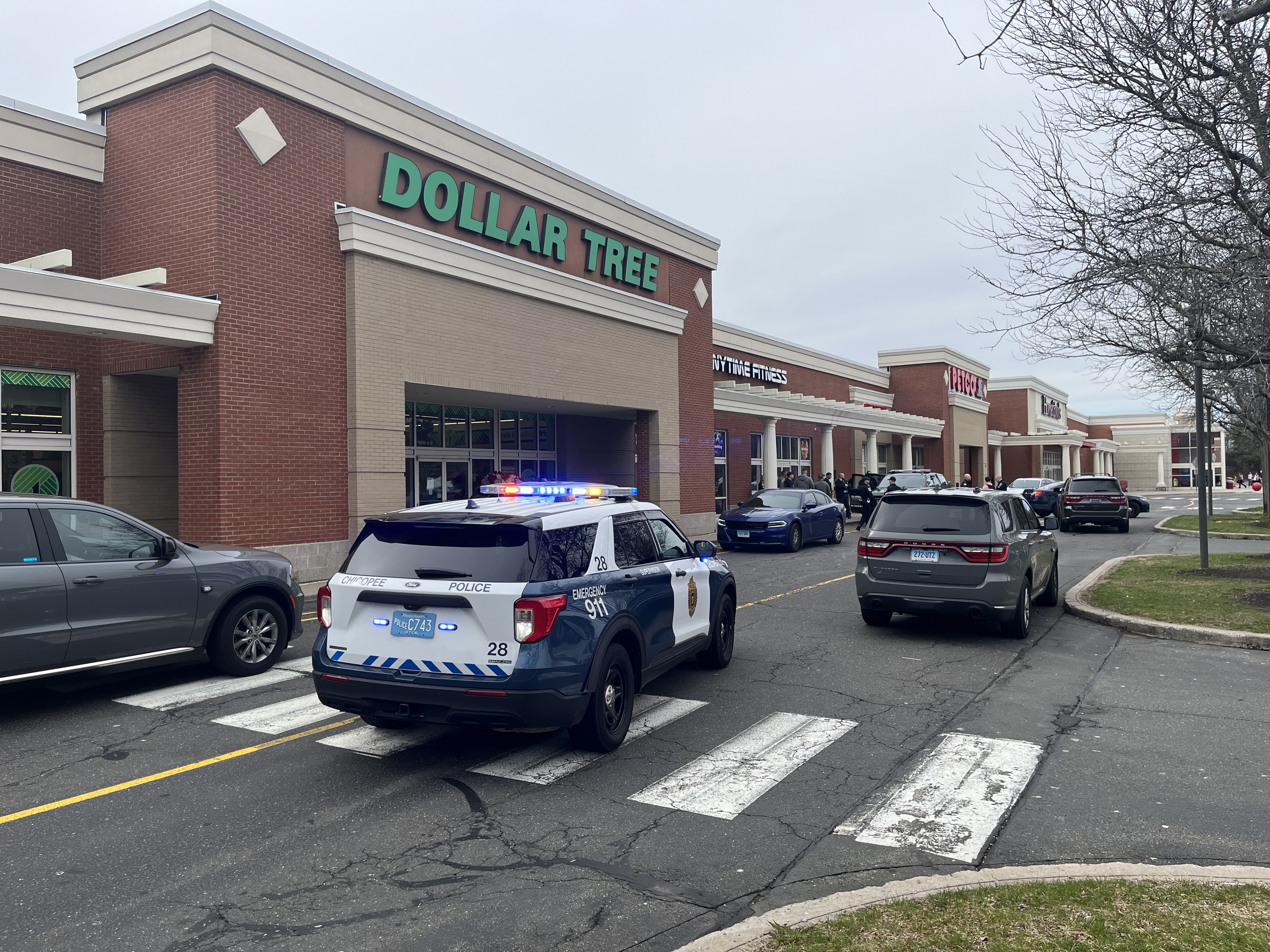 Chicopee, Massachusetts, police at the scene of the shopping plaza in Windsor, Connecticut, where a man who stole a vehicle with a child inside in Chicopee was taken into custody Friday, March 29, 2024.