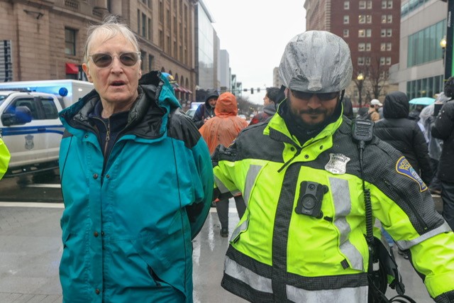 A police officer makes an arrest during a pro-Palestinian demonstration that disrupted traffic outside Boston's South Station on Thursday, March 7, 2024.