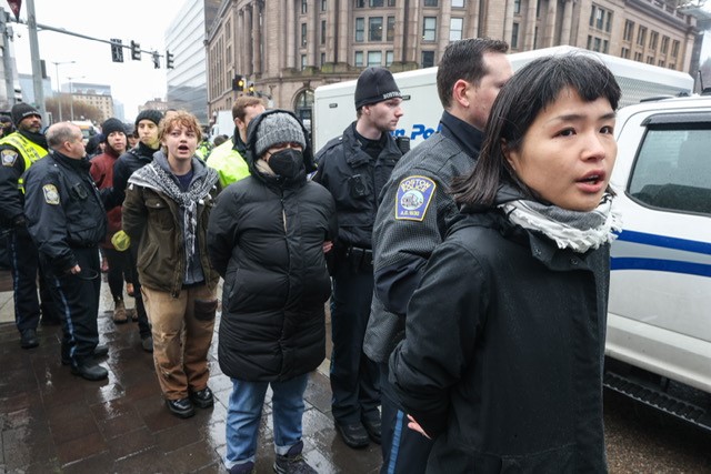 Police make arrests during a pro-Palestinian demonstration that disrupted traffic outside Boston's South Station on Thursday, March 7, 2024.