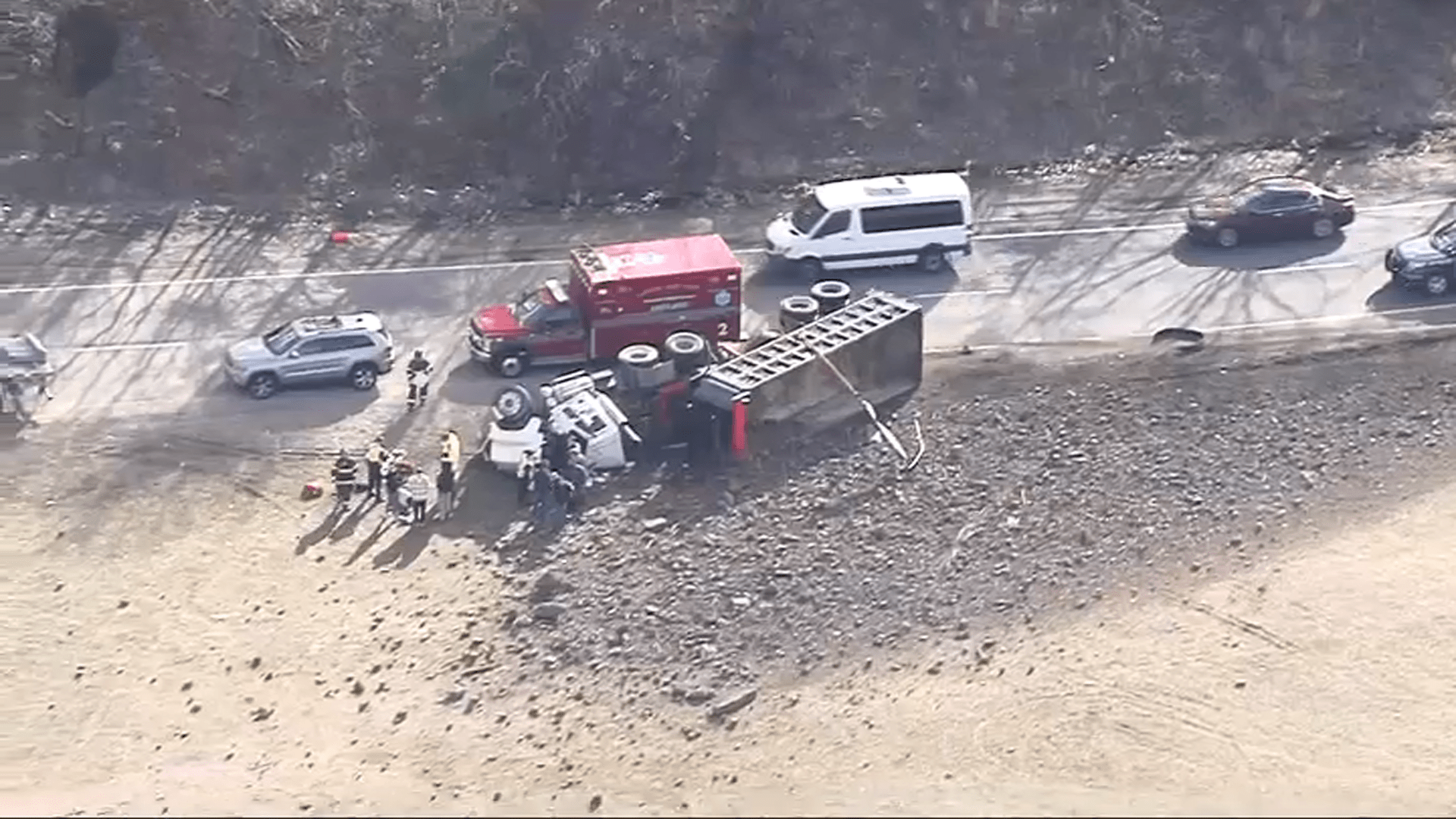 A crashed dump truck on the ramp from Interstate 93 south to Interstate 95 south in Canton, Massachusetts, on Monday, March 11, 2024.