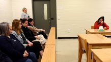 Kayla Montgomery, the estranged wife of convicted murderer Adam Montgomery, the man who beat his 5-year-old daughter Harmony to death in 2019, wipes away tears during questions from the parole board at the New Hampshire Correctional Facility for Women in Concord, N.H., on March 7, 2024. At left is Michelle Raftery, a foster mother for Harmony.