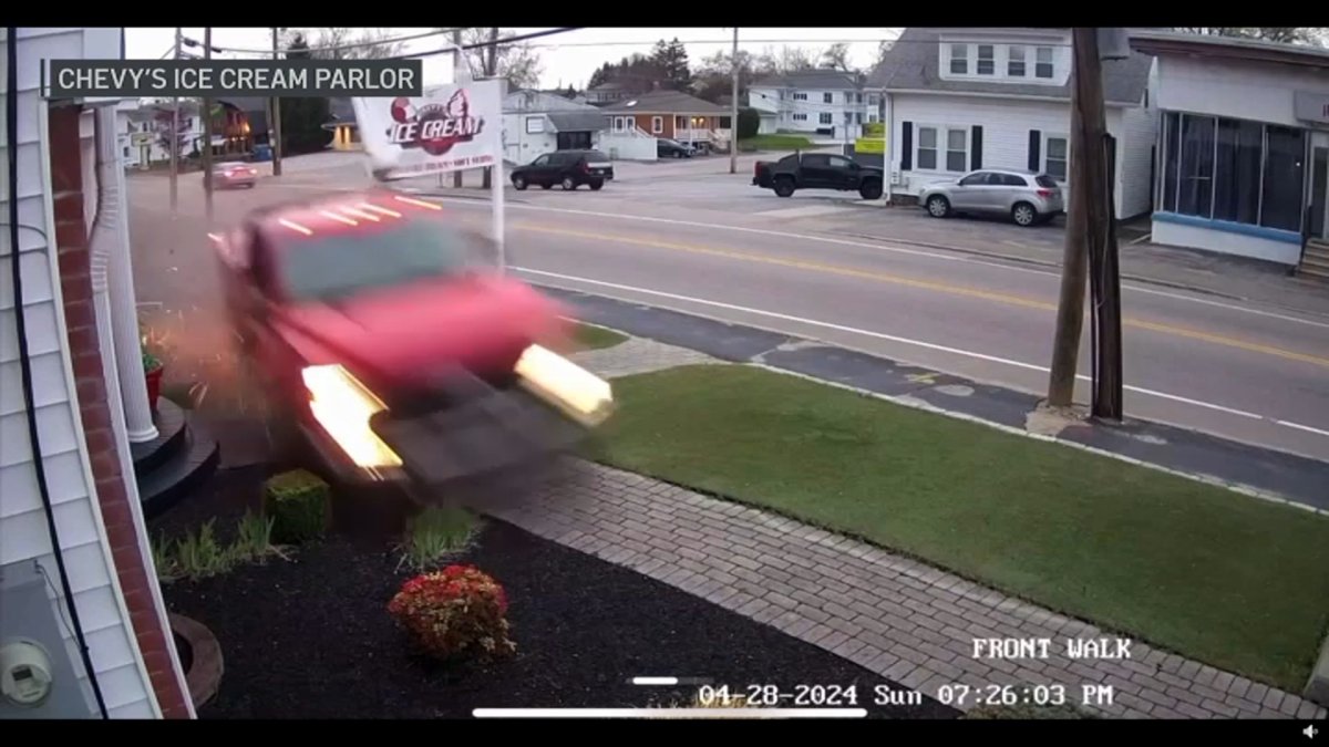 WATCH: Out-of-control truck slams into sign, narrowly avoids car with woman and baby inside – NBC Boston