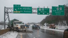 A truck slammed into a highway sign on the Everett Turnpike in Nashua, New Hampshire, amid a storm on April 4, 2024, closing the road for hours.