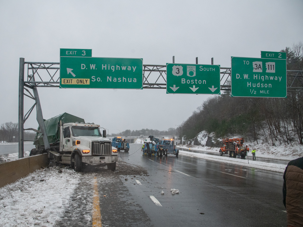 A truck slammed into a highway sign on the Everett Turnpike in Nashua, New Hampshire, amid a storm on April 4, 2024, closing the road for hours.