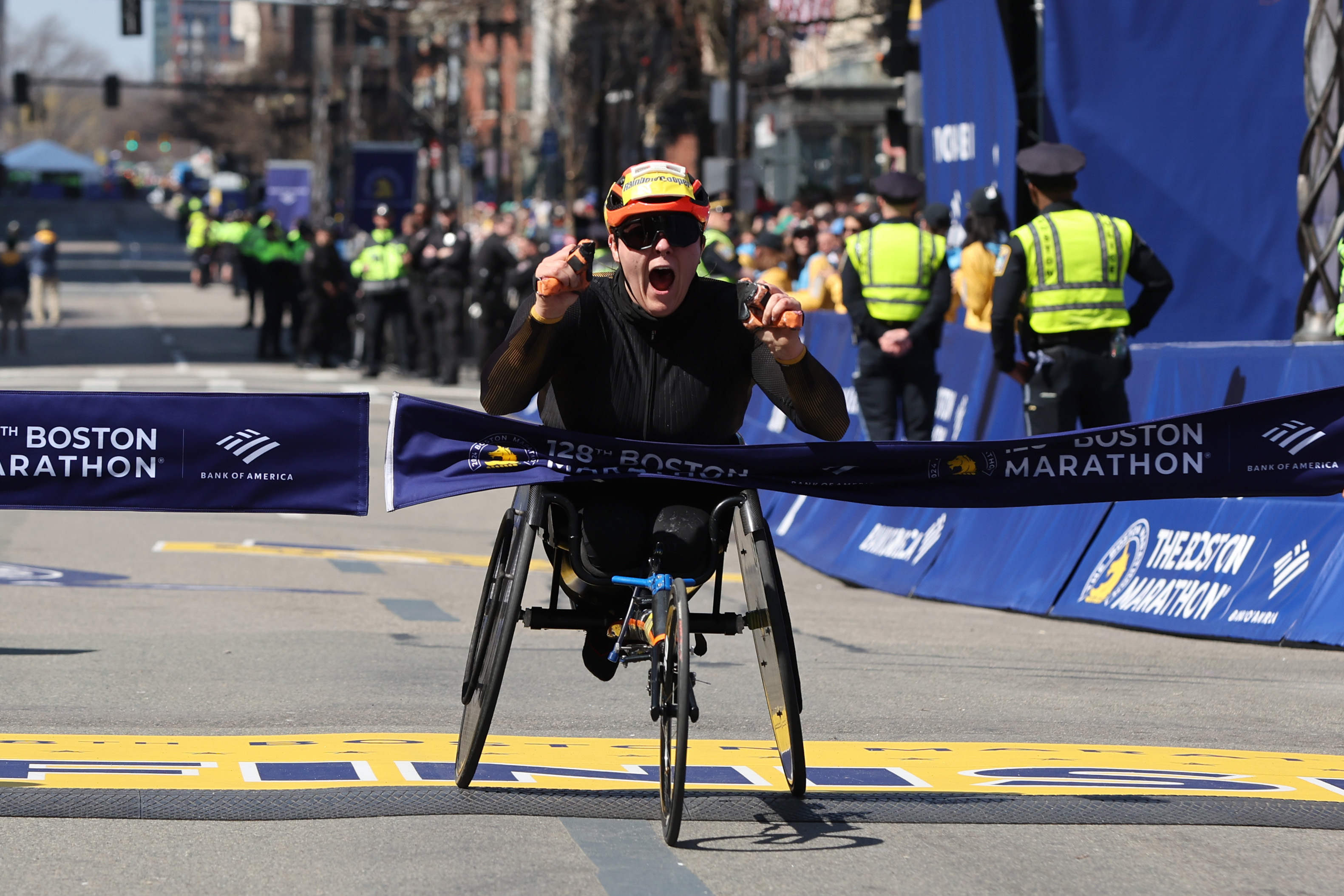 Eden Rainbow-Cooper of Great Britain crosses the finish line to win the Professional Women’s Wheelchair Division at the 128th Boston Marathon on Monday, April 15, 2024.