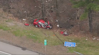 A crashed car off I-495 in Chelmsford, Massachusetts, on Tuesday, April 30, 2024.