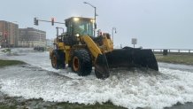 A bull pushes flood waters in Lynn, Massachusetts, on Thursday, April 4, 2024.