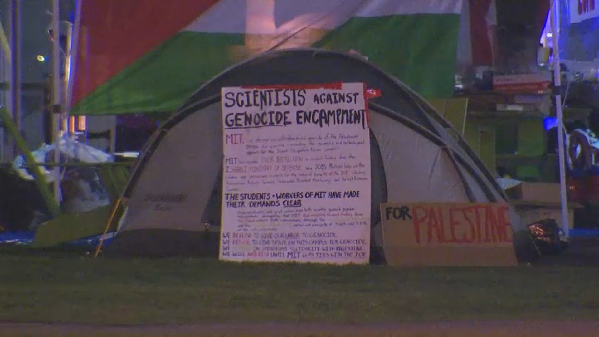 A sign outside a tent at a "scientists against genocide" protest encampment at MIT in Cambridge, Massachusetts, on Monday, April 22, 2024.