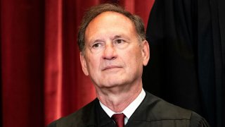 Associate Justice Samuel Alito poses during a group photo of the Justices at the Supreme Court in Washington, April 23, 2021.