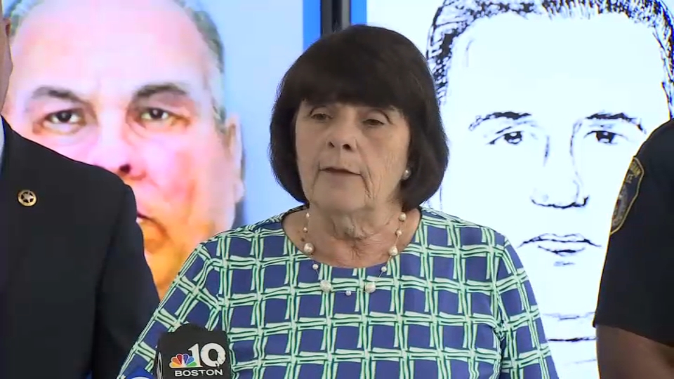 Middlesex District Attorney Marian Ryan talks about the search for a man now suspected of raping two women in a store in Framingham, Massachusetts, in 1989.  Police photos of the suspect can be seen behind Ryan.