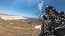 This image from remote video released by the U.S. Air Force shows Air Force Secretary Frank Kendall during his experimental flight inside the cockpit of a X-62A VISTA aircraft autonomous warplane above Edwards Air Base, Calif, on Thursday, May 2, 2024. The AI-controlled flight is serving as a public statement of confidence in the future role of AI in air combat. (United States Air Force Photo via AP)