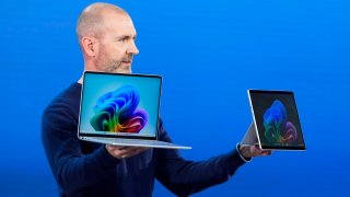 Brett Ostrum, Microsoft corporate vice president of Surface, holds up the new Surface Laptop and Surface Pro with built-in AI hardware during a showcase event of the company’s AI assistant, Copilot, at Microsoft headquarters, Monday, May 20, 2024, in Redmond, Wash.