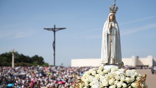 A statue of Our Lady of Fatima is pictured during a procession at the Shrine of Fatima, central Portugal, on May 13, 2022. Thousands of pilgrims converged on the Fatima Sanctuary to celebrate the anniversary of Fatima’s miracle when three shepherd children claimed to have seen the Virgin Mary in May 1917.