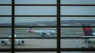 File. JetBlue, American Airlines and Delta Air Lines airplanes at Ronald Reagan National Airport (DCA) in Arlington, Virginia, U.S., on Tuesday, Nov. 21, 2023.