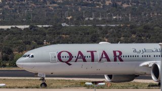 FILE - Qatar Airways passenger plane