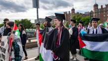 Pro-Palestinian students march over the Massachusetts Avenue bridge after walking out during the OneMIT Commencement Ceremony at the Massachusetts Institute of Technology (MIT) in Cambridge, Massachusetts on May 30, 2024. (Photo by Joseph Prezioso / AFP) (Photo by JOSEPH PREZIOSO/AFP via Getty Images)