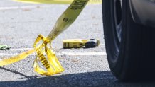 A stun gun behind police tape amid an investigation in Malden, Massachusetts, on Wednesday, May 22, 2024.
