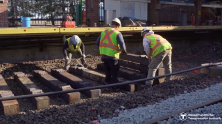 Workers fixing track on the MBTA Blue Line in East Boston.