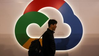 A person walks next to the Google Cloud logo at the Mobile World Congress (MWC) in Barcelona, Spain February 27, 2023.