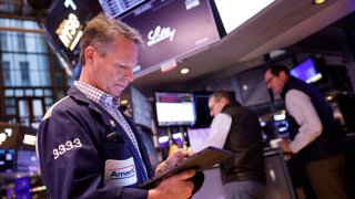 Traders work on the floor of the New York Stock Exchange during morning trading on Feb. 23, 2024 in New York City.