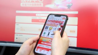 A Chinese shopper buys goods online in Zhoushan city, East China’s Zhejiang province, June 18, 2024.