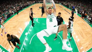 BOSTON, MASSACHUSETTS – JUNE 06: Kristaps Porzingis #8 of the Boston Celtics dunks the ball during the first quarter against the Dallas Mavericks in Game One of the 2024 NBA Finals at TD Garden on June 06, 2024 in Boston, Massachusetts. NOTE TO USER: User expressly acknowledges and agrees that, by downloading and or using this photograph, User is consenting to the terms and conditions of the Getty Images License Agreement. (Photo by Maddie Meyer/Getty Images)