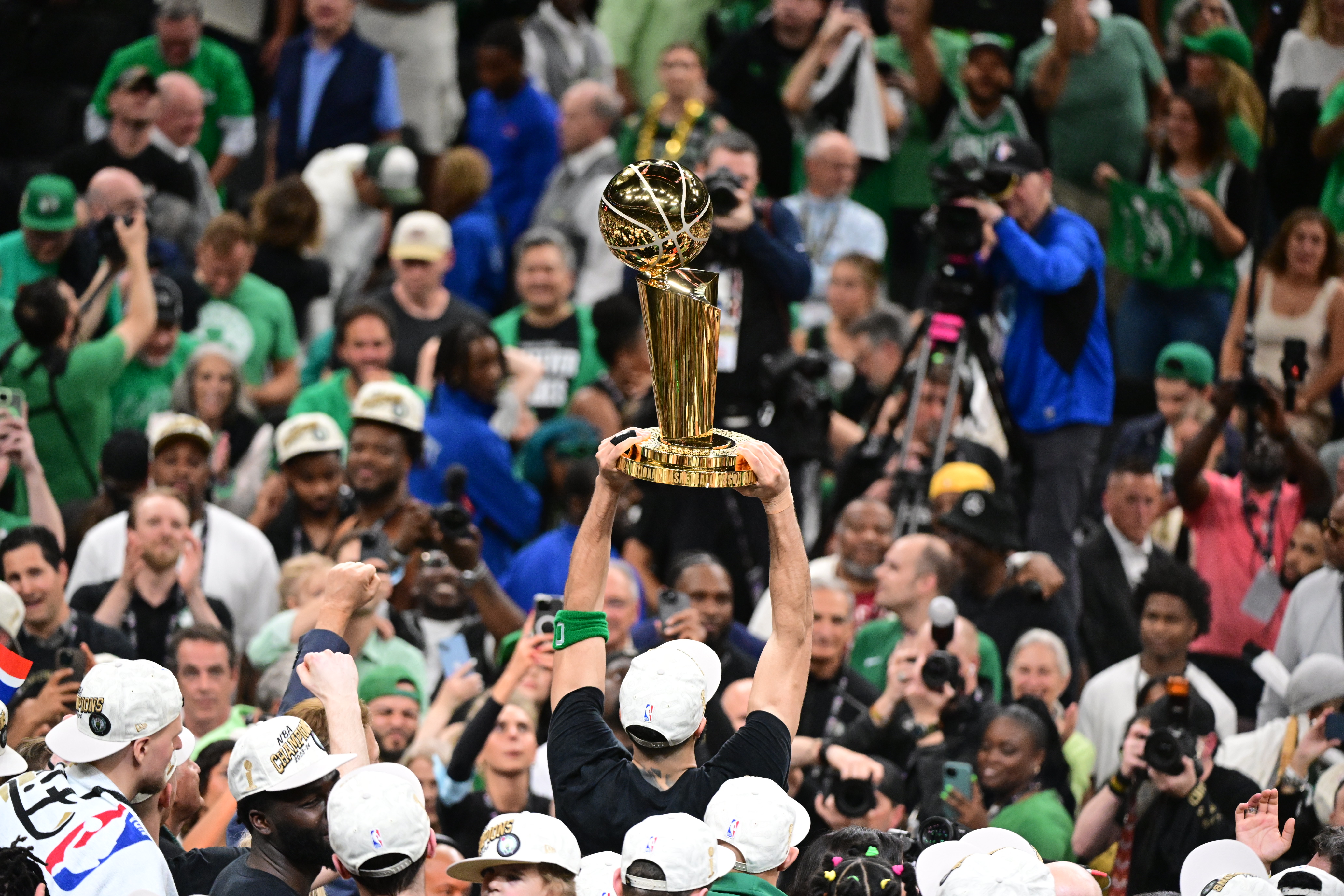 Jayson Tatum celebrates with the Larry O’Brien Trophy after winning the 2024 NBA Championship with the Boston Celtics, beating the Dallas Mavericks in Game Five of Finals at TD Garden on Monday, June 17, 2024.