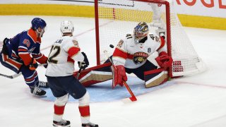 Dylan Holloway #55 of the Edmonton Oilers scores a goal past Anthony Stolarz #41