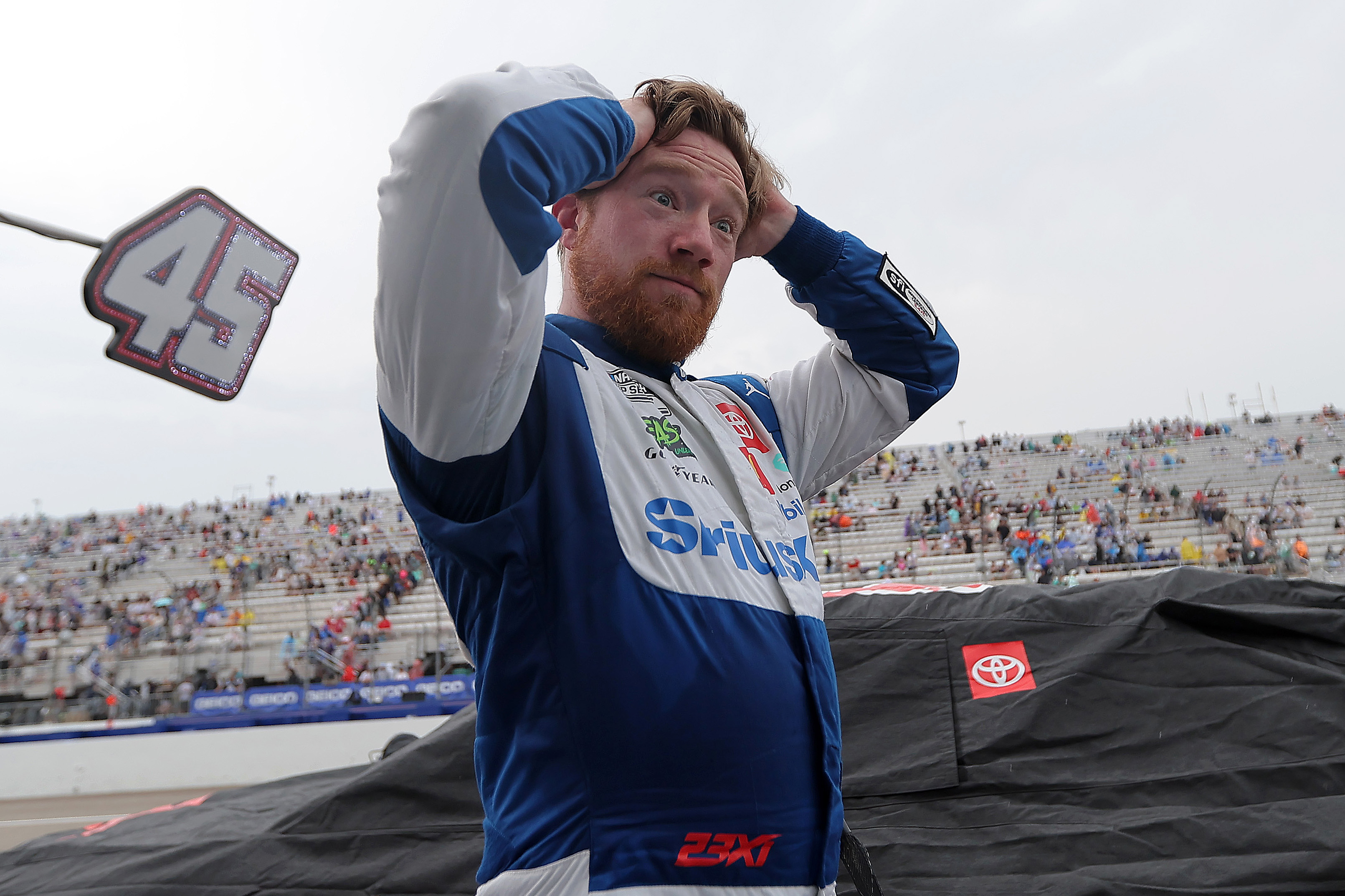 Tyler Reddick, driver of the #45 SiriusXM Toyota, waits on the grid during a weather delay in the NASCAR Cup Series Today 301 at New Hampshire Motor Speedway in Loudon on Sunday, June 23, 2024.