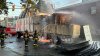 Truck catches fire after striking bridge in Malden