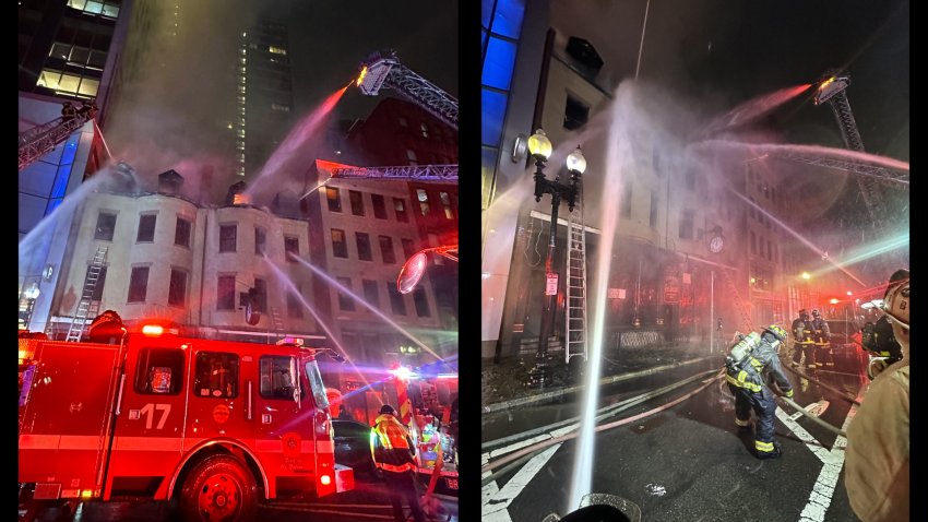 Firefighters battling a blaze late Monday, June 24, 2024, that appeared to be burning in the buildings that have housed the historic Jacob Wirth Restaurant in Boston's Theater District.