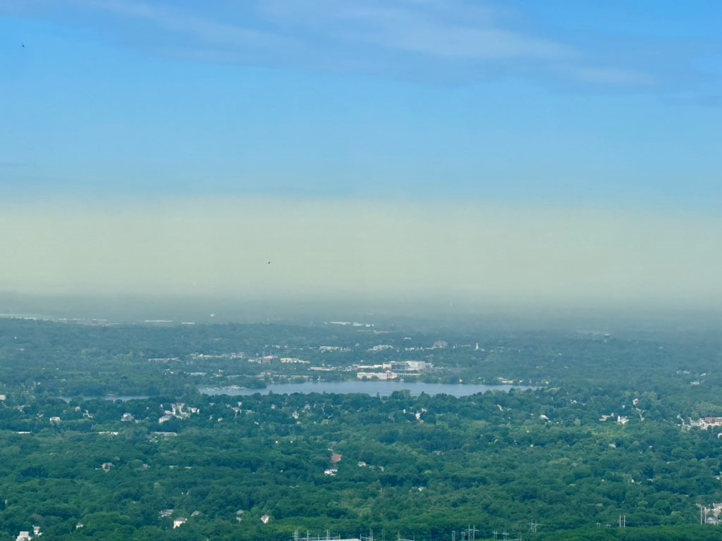 A layer of yellow haze from pollen over Boston on Monday, June 3, 2024.