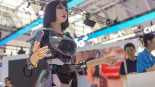 TIANJIN, CHINA – JUNE 20: A humanoid robot Xiao Qi is on display during the 2024 World Intelligence Expo at the National Convention and Exhibition Center (Tianjin) on June 20, 2024 in Tianjin, China. (Photo by VCG/VCG via Getty Images)