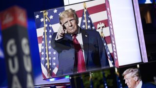 Images of Donald Trump appear on stage screens in the Fiserv Forum on the day before the Republican National Convention (RNC) on July 14, 2024, in Milwaukee, Wisconsin. The RNC will be held in Milwaukee from July 15-18. 