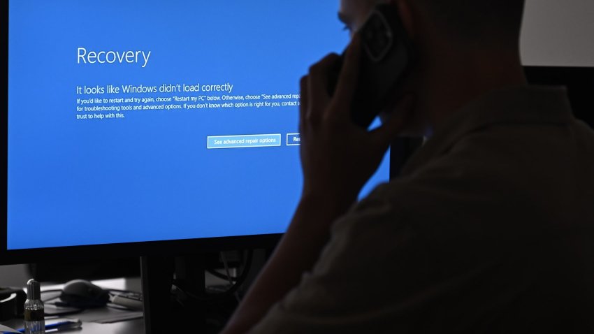 The blue screen of death errors on computer screens are viewed due to the global communications outage caused by CrowdStrike, which provides cyber security services to US technology company Microsoft, on July 19, 2024 in Ankara, Turkey. 